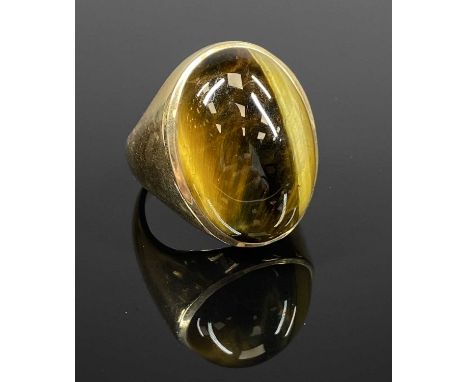 TIGER'S EYE RING in yellow metal mount marked '10k', size T, 20gmsProvenance: private collection Conwy