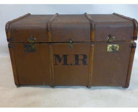 An early 20th century travel trunk with label for 'Denty's Trunk Stores', H.55 W.93 D.57cm 