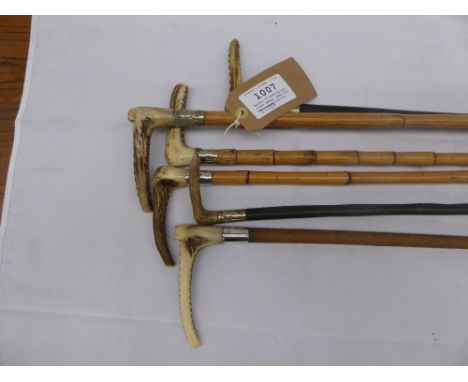 6 hunting crops - a bamboo crop with antler handle and hallmarked silver collar; two leather bound crops with antler handles 