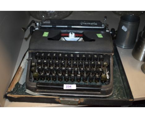 An Olympia typewriter in case olive green