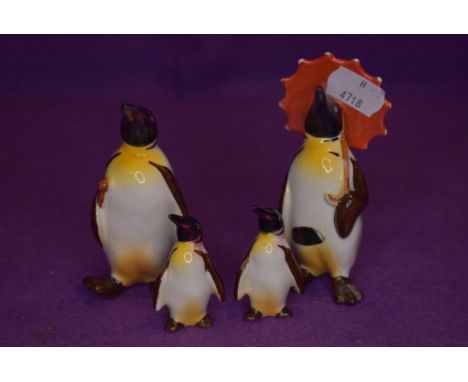 Four Beswick studies, Penguin with Umbrella 802, Penguin with Walking Stick 803, Penguin Chicks 800 &amp; 801