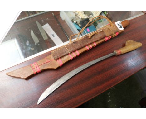 Interesting Tribal knife in wooden scabbard. 60cm in Length 