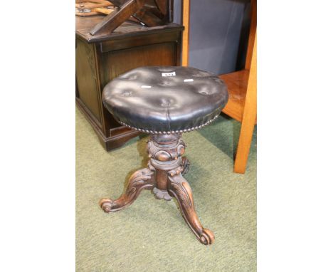 19thC Victorian Gothic Revolving Piano Stool With Carved baluster support over scroll tripod legs