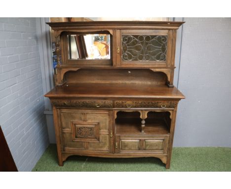 Late 19th Century Oak Arts &amp; Crafts Dresser With Stained Leaded Glass Cupboard Detailing Over Carved Panel Front.