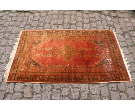 Red Ground Persian Style small Rug with tassel ends 87 x 140cm 