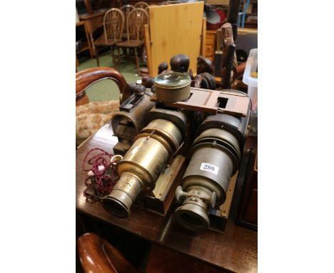 3 Antique Magic Lanterns in brass and tin cases with assorted Lenses 
