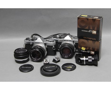 An Olympus OM-2n Camera, together with an OM-2, with Auto-W  f/2.8 28mm lens and accessories (a lot)