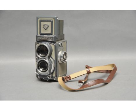 A Rollei Baby Rolleiflex 4x4 TLR Camera, green, with maker's strap