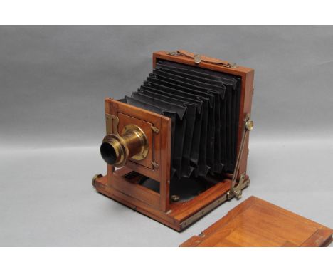 An Un-Marked Mahogany Field Camera, with Wray brass lens with unusual iris, together with one DDS