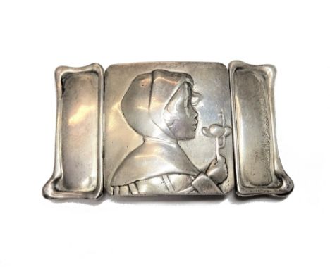 A lady's silver Art Nouveau waist belt buckle, the centre cast as the portrait of a girl holding a flower, between shaped sid