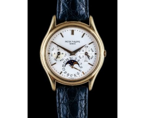 A Patek Philippe gold circular cased gentleman's calendar wristwatch, the jewelled automatic movement detailed Patek Philippe