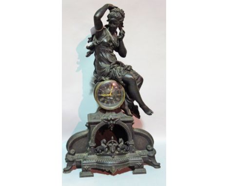 An early 20th century spelter figural mantel clock, 45cm wide x 74cm high.