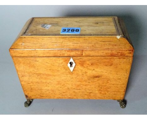 A Regency inlaid mahogany rectangular tea caddy with metal claw feet, 19cm wide x 16cm high. 