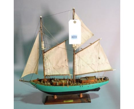 A modern wooden model of a sailing boat, 51cm wide x 51cm high. 