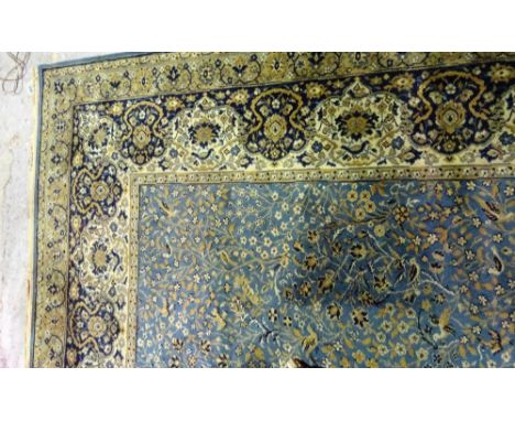 A mid-blue Wilton machine made Persian style carpet, 460cm x 318cm. 