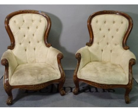 A pair of Victorian style stained beech low armchairs, with button back upholstery, 73cm wide x 104cm high. (2) 