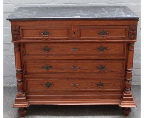 A late 19th century French marble top pitch pine commode, with two short over three long drawers, flanked by columns, 102cm w