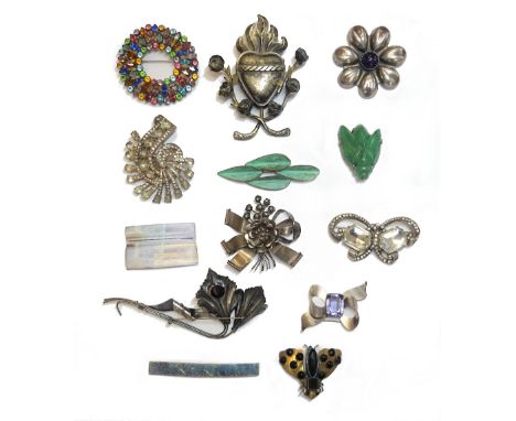 A Mexican cabochon amethyst brooch, designed as a stylized flowerhead, two colourless paste set brooches, detailed Eisenberg 