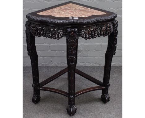 An early 20th century Chinese corner jardiniere stand, with marble inset top over carved hardwood base, 68cm wide x 81cm high