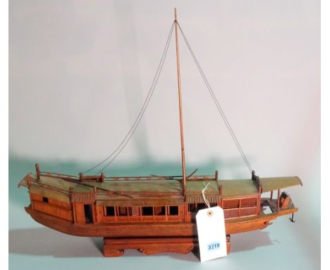 A modern hardwood model of a Chinese Junk, 63cm wide x 53cm high. 