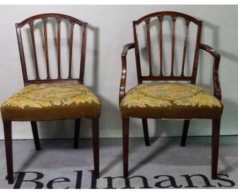 A set of six George III mahogany stick back dining chairs, to include one carver, 56cm wide x 88cm high. (6) 