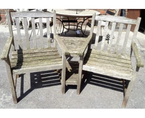 A modern softwood garden conversation bench, 155cm wide x 90cm high. 