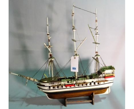 A modern wooden model of a triple mast galleon, 84cm wide x 80cm high. 