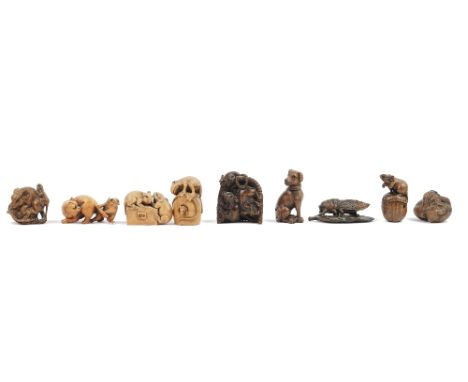 A group of eight late Japanese wood netsukes of animals, including dogs, a frog, a cat, rats  and mice, some signed; also a w