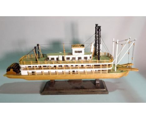 'The Queen of Mississipi', a modern wooden model of a paddle boat, 70cm wide x 35cm high.