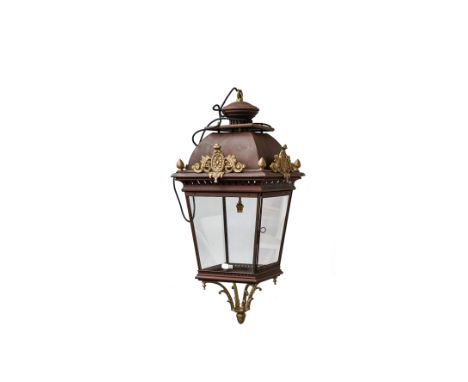 A Victorian style gilt and patinated metal lantern, modern, with gilt acorn finials over a square tapering body and internal 