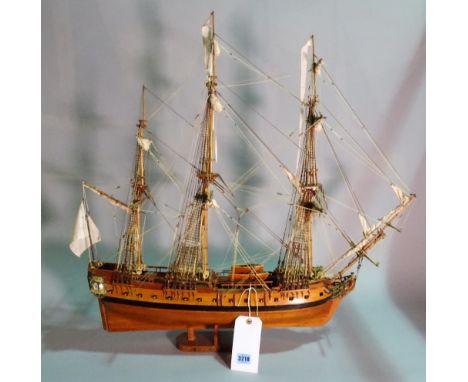 A modern wooden model of a triple mast galleon, within a modern stained beech framed glass display case, 90cm wide x 95cm hig