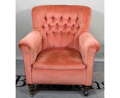 A late Victorian mahogany framed tub back armchair, with pink button back upholstery on turned supports, 78cm wide x 92cm hig