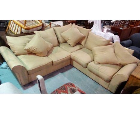 A modern hardwood framed corner sofa, with beige upholstery on bun feet, 227cm wide x 70cm high.