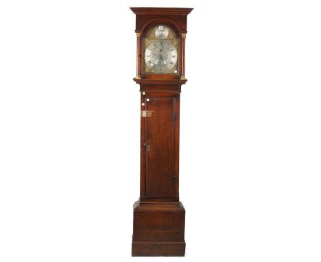 An 18th century oak longcase clock by Thomas Harben Lewes, with arch top hood, brass and silvered dial plate and weight drive