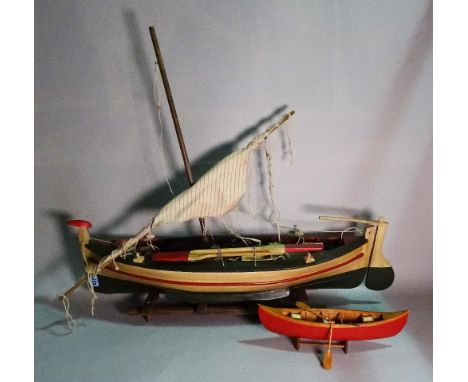 A modern wooden model of a sailing boat, 81cm wide x 26cm high. (a.f.) 