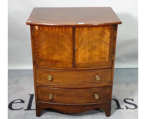 A George III and later mahogany bowfront commode chest, with cupboard doors over two short drawers, 60cm wide x 74cm high. 