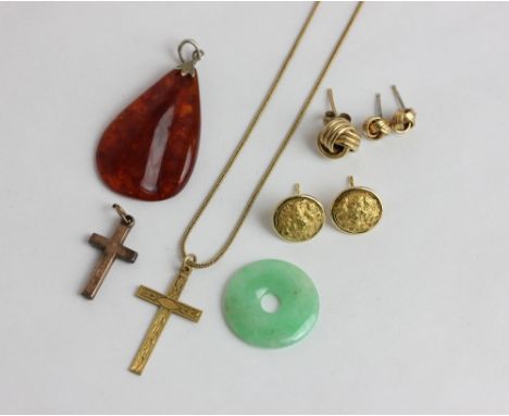 A jade pendant, and amber pendant, two gold cross pendants, a pair of 18ct gold ear studs 6g, and three studs