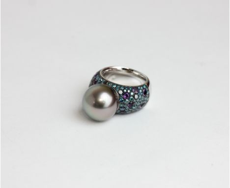 A Tahitian silver grey pearl and gem set dress ring, the shoulders pavé set with graduated amethysts and graded sapphires in 