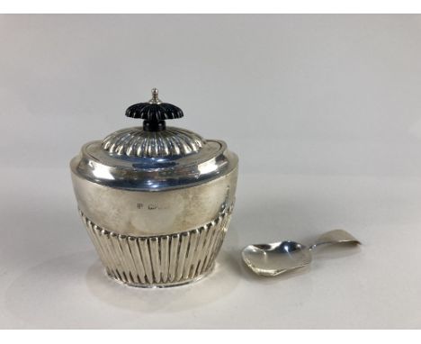 An Edward VII silver tea caddy, makers Barker Brothers, Chester 1909, of half reeded form, together with an Irish silver cadd