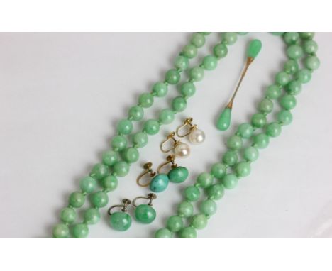A jade bead necklace; a pair of jade drop earrings; a pair of pearl earrings