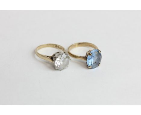 A cubic zirconia dress ring in 9ct yellow gold, a blue paste ring in 9ct gold