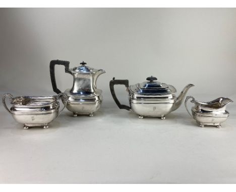 A George V silver four piece tea set, maker Harrison Brothers &amp; Howson, Sheffield 1920 and 1921, of oblong form, on ball 