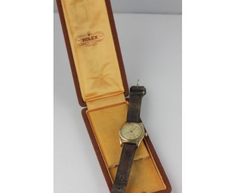 Rolex. An 9ct gold wrist watch Oyster Perpetual chronometer screw-off tattle back with presentation inscription screw down cr