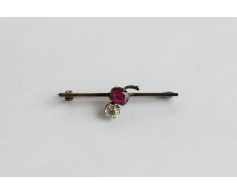 An old cut diamond and ruby bar brooch 