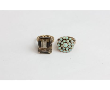 An opal cluster ring; a smoky quartz dress ring