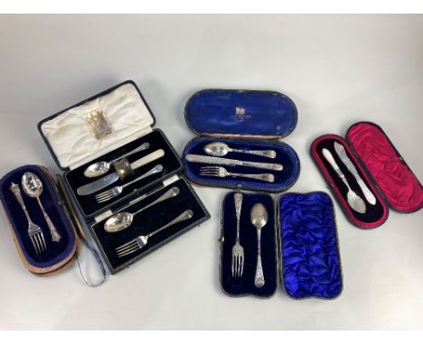 Six Victorian and later cased silver christening sets, (some matched, some part) including a floral engraved spoon and fork s