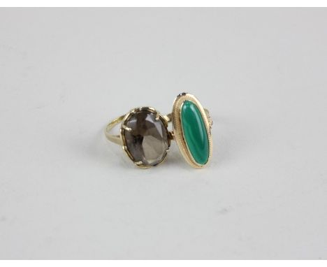 A jade ring in 14ct gold; a smoky quartz ring in 9ct gold