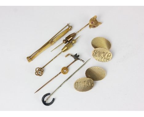 A pair of 9ct gold oval engine turned cuff links 15g; a gold fox mask stick pin; various stick and tie pins