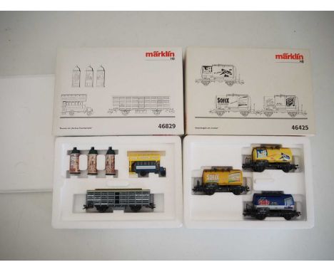 A pair of MARKLIN HO gauge wagon / accessory sets comprising 46829 'Berlin Suburban Traffic Set' together with 46425 'Tank Wa