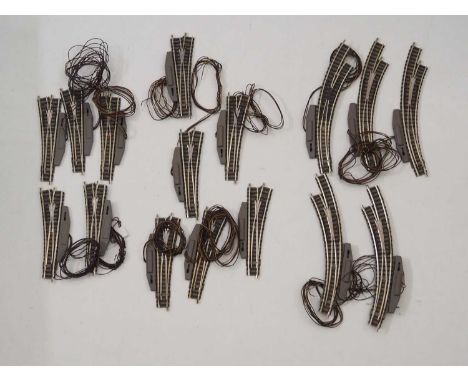 A large quantity of unboxed FLEISCHMANN Piccolo N gauge electric points including straight and curved examples, LH and RH, ap